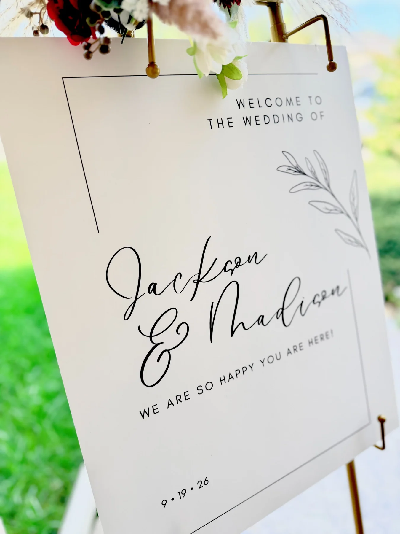 Dark-toned close-up of orange and burgundy easel florals