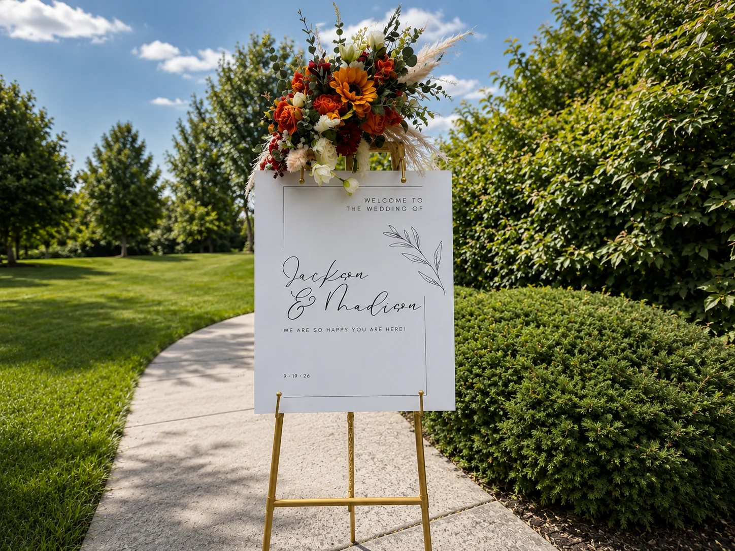 Fully styled wedding easel outdoors with fall florals