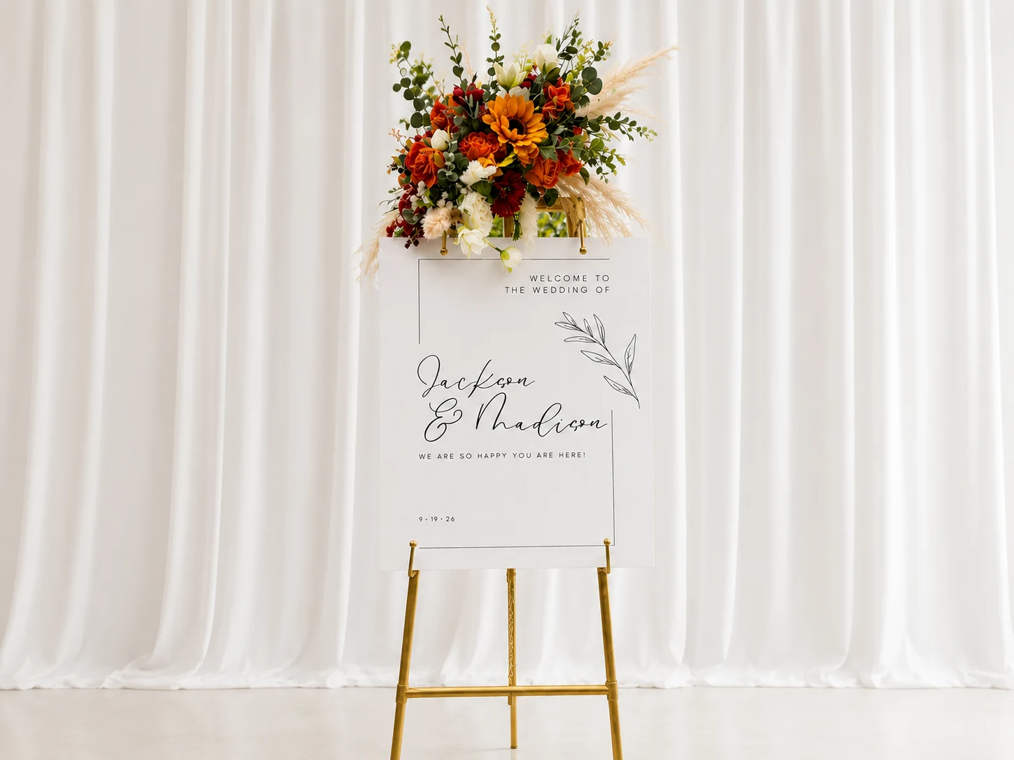 Fully styled gold easel with fall florals in studio