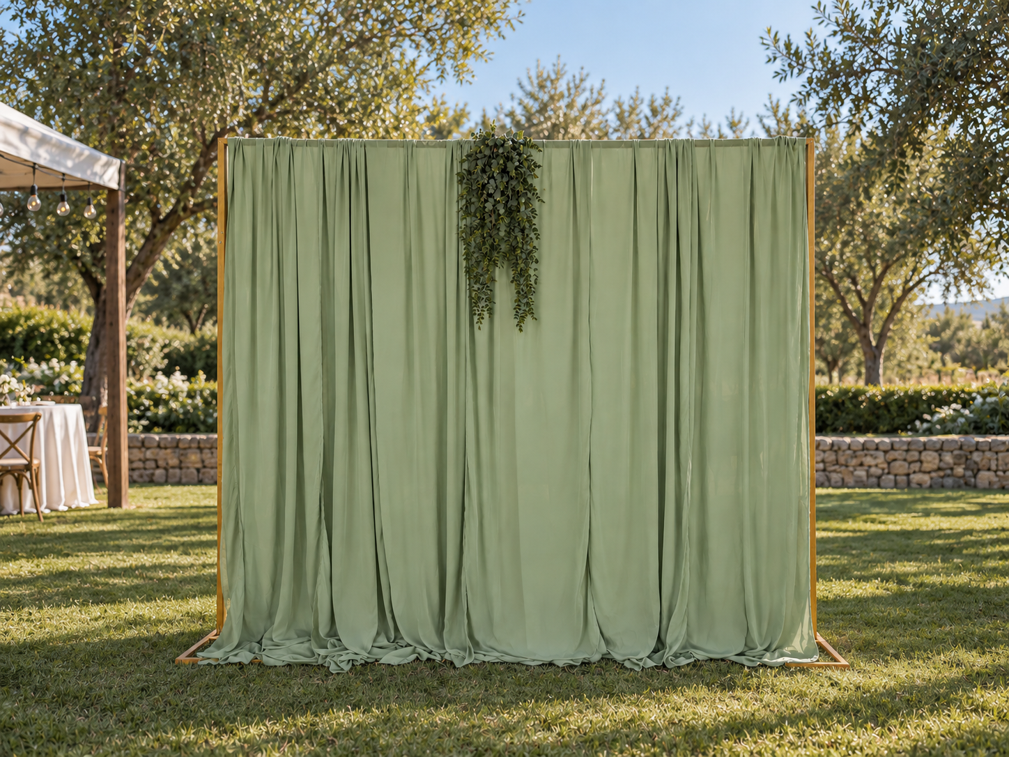 Eight foot square photo backdrop with sage green draping