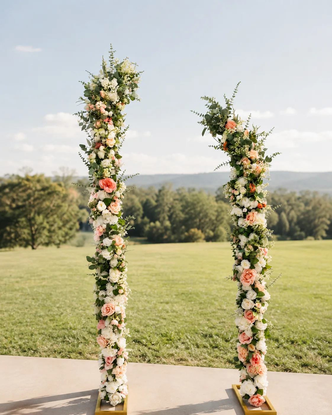 Blush floral ceremony arches outdoors