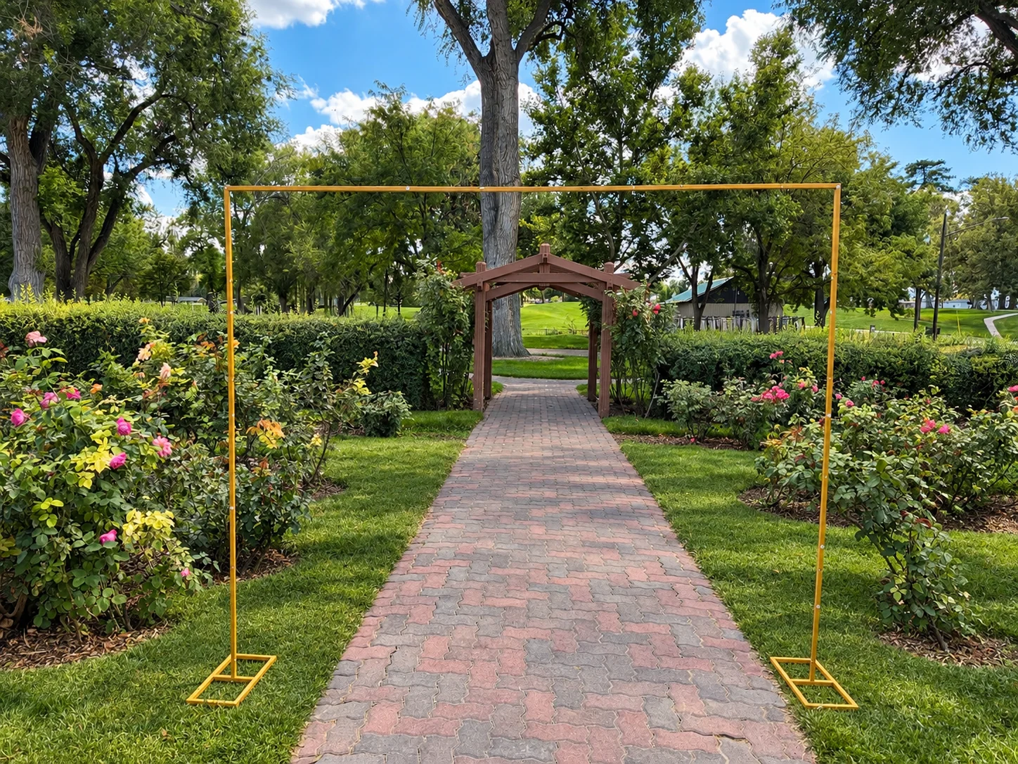 Bare gold square arch in a garden setting