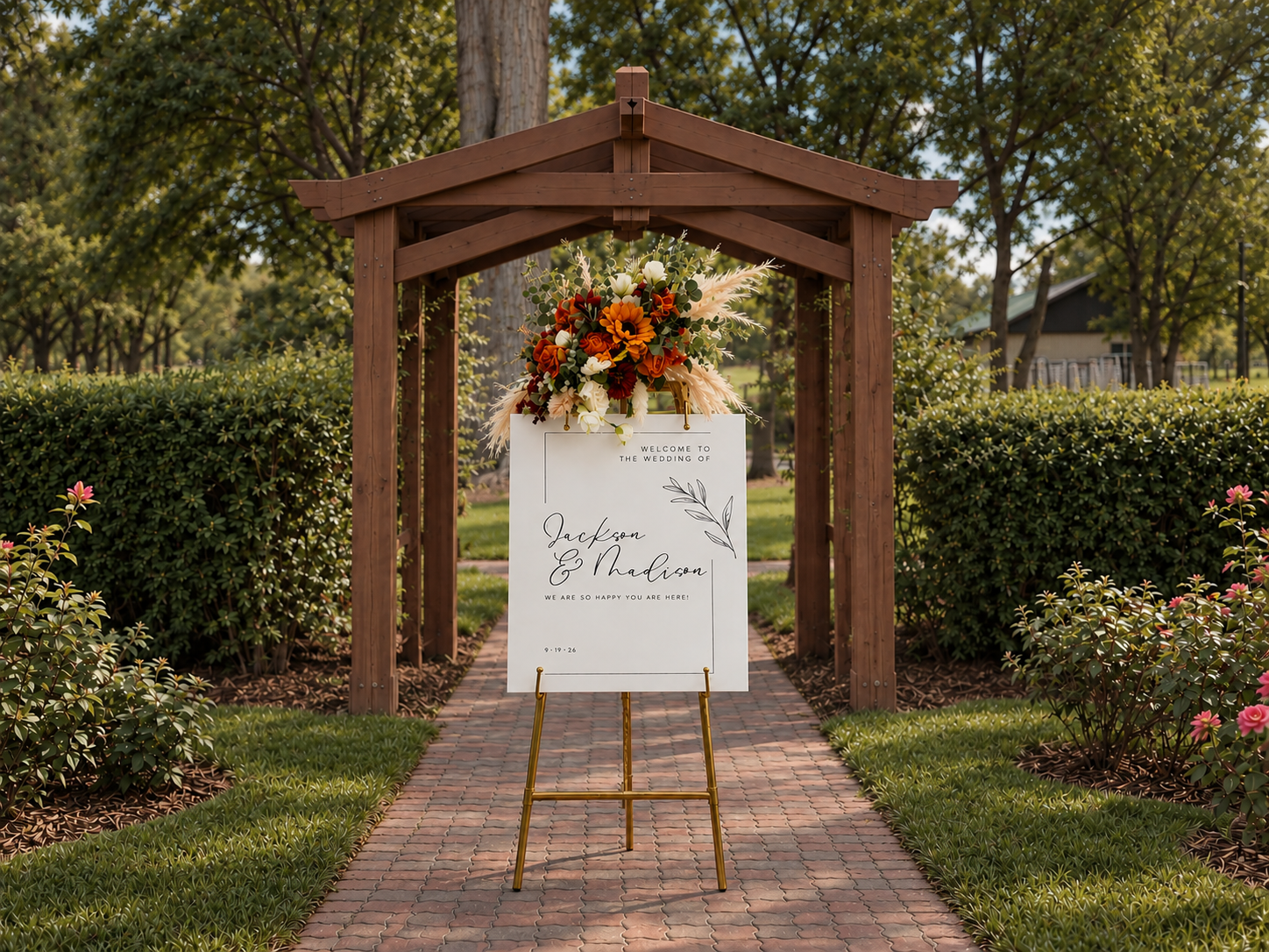 Fully styled wedding easel displayed in front of a wooden garden arch