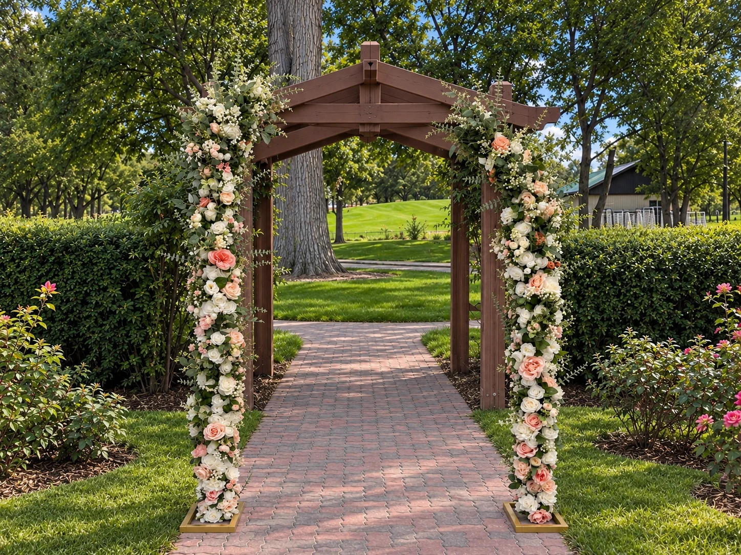 Two-piece floral arch framing a wooden garden entry